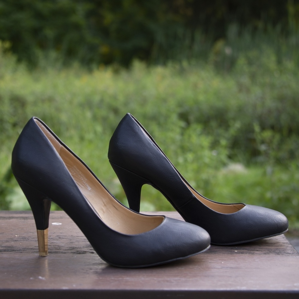 Classic Black Round Toe Heels with Gold Accent